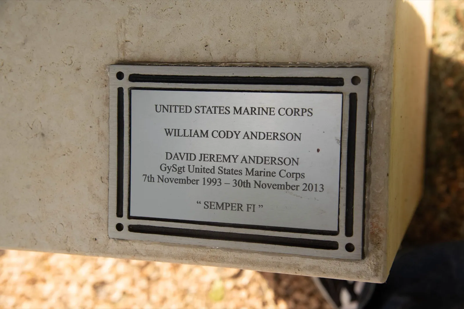 An engraved plaque honoring a United States Marine Corps veteran